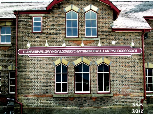 Train Station
Taken whilst on holiday in North Wales on the Isle of Angelsea. The longest name of a railway station in the UK
Llanfairpwllgwyngyllgogerychwyrndrobwllllantysiliogogogoch
Translated from welsh Into English - "St Mary's Church in the Hollow of the White Hazel near a Rapid Whirlpool and the Church of St. Tysilio near the Red Cave". 
