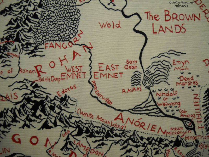 Map of the Middle Earth (2)
I tried to take in photo the duplicata of the map, but I failed. The window blurs all. So here is just a detail of the tapestry itself.
The map wasn't supposed to be a part of the hanging wall. The project was changed when Christopher Tolkien died. It's an hommage to his work with his father.
Also, it's one of the two tapestries not having plenty colors, so being "apart" in the hanging wall.
